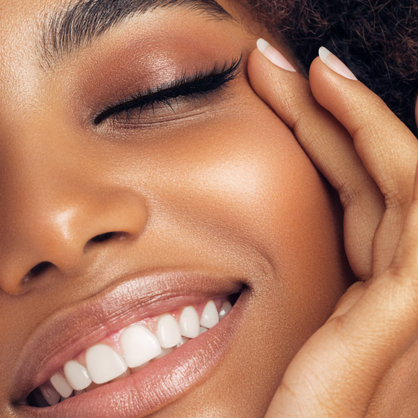 woman with perfect skin smiling